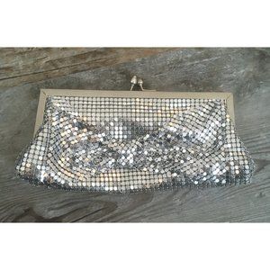 Silver metal mesh clutch with mesh bow on front